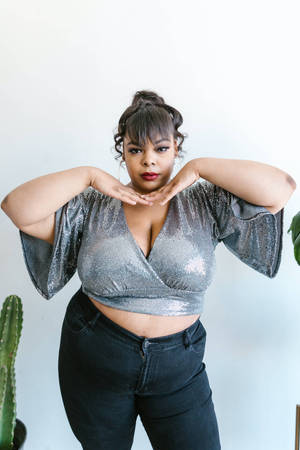 Fat Girl In A Silver Metallic Cropped Top Wallpaper