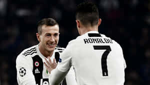 Federico Bernardeschi And Teammate Cristiano Ronaldo Wallpaper