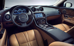 Feel The Luxury Of A Mocha Black Jaguar Wallpaper