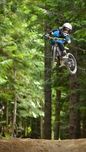 Feel The Thrill Of Adventure As You Cycle Through The Mountainous Terrain With Your Iphone. Wallpaper