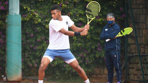 Felix Auger Aliassime Determined Stance Wallpaper