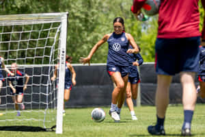 Female Soccer Player Training Session Wallpaper