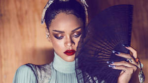 Fenty Rihanna Holding A Fan Wallpaper