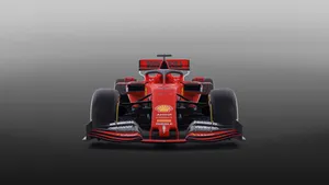 Ferrari F1 Car In Red On A Grey Background Wallpaper
