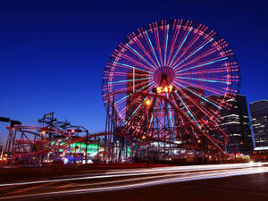 Ferris Wheel At Amusement Park Wallpaper