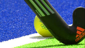 Field Hockey Stick And Ball Wallpaper