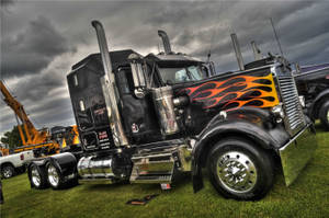 Fiery Kenworth Truck In Motion Wallpaper