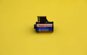 Film Roll On Yellow Background Wallpaper