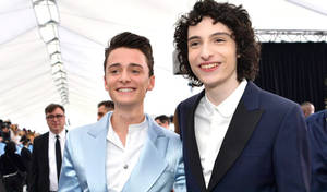 Finn Wolfhard With Other Celebrities Wallpaper