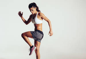 Fit Woman Doing Warm Up Wallpaper