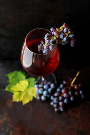 Flat Lay Wine With Grapes Wallpaper