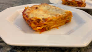 Flavorful Italian Cuisine - Lasagna Alla Bolognese Wallpaper