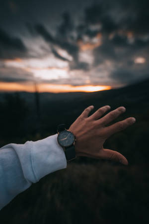 Focus Hand Wearing Black Watch Wallpaper