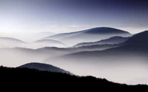 Foggy Mountainous Natural Background Wallpaper