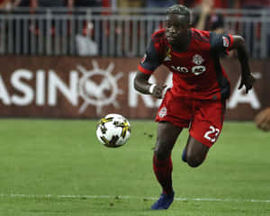 Football Player Chris Mavinga Chasing Ball Wallpaper