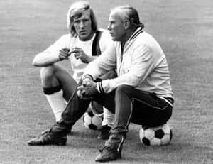 Football Strategy Discussion Blackand White Wallpaper