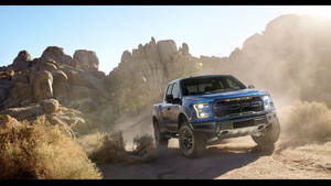 Ford F 150 Raptor On Terrain Wallpaper