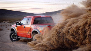 Ford Raptor With Dust Trail Wallpaper