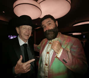 Former American Wwe Wrestler Mick Foley With Dory Funk Jr Wallpaper