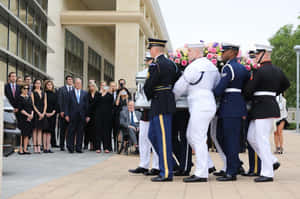 Former U.s. President George W. Bush Delivering A Speech Wallpaper