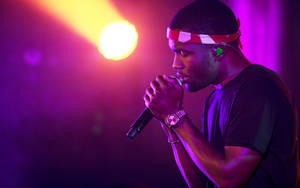 Frank Ocean Performing At A Concert Wallpaper