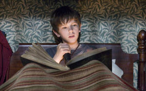 Freddie Highmore Read Book Wallpaper