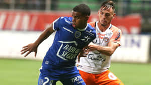 French Footballers Samuel Grandsir And Ruben Aguilar Ligue 1 Match Wallpaper