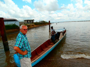 French Guiana Man Near Boat Wallpaper