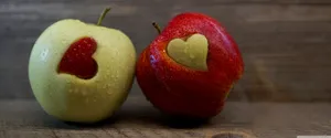 Fresh Apple Laptop On Wooden Surface Wallpaper
