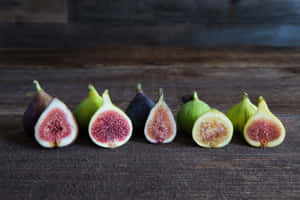 Fresh Figs Variety Wooden Background Wallpaper