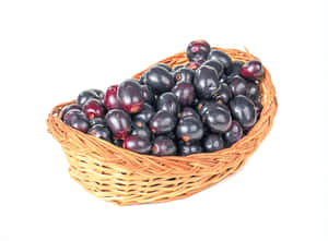 Fresh Java Plums In A Weaved Basket Wallpaper