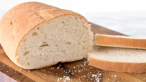 Freshly Baked Loaf With Slices Of Bread Wallpaper