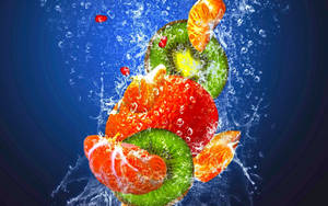 Fruits Falling In The Water Wallpaper