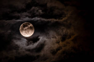 Full Moon In Dark Cloudy Sky Wallpaper