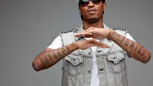 Future Rapper Pfp With Arm Tattoos Wallpaper