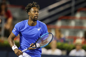 Gael Monfils Running In Blue Shirt Wallpaper