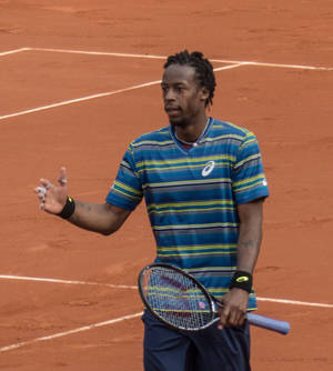 Gael Monfils Wearing Striped Shirt Wallpaper