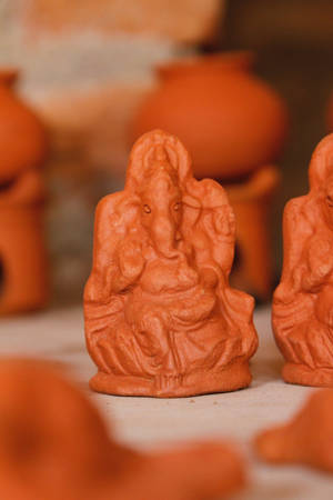 Ganesha On Throne Clay Figure Wallpaper