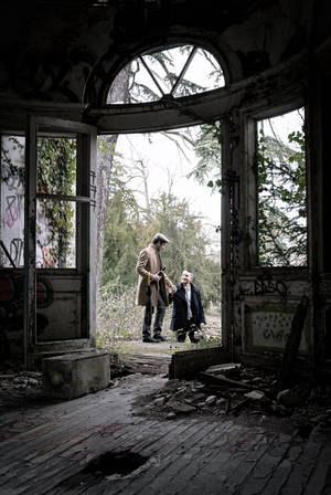 Gay Men Outside Crumbling House Wallpaper