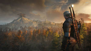 Geralt Of Rivia Overlooking A Mountain Landscape Wallpaper