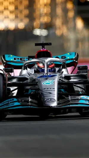 Get Behind The Wheel Of The Mercedes-f1 Iphone. Wallpaper