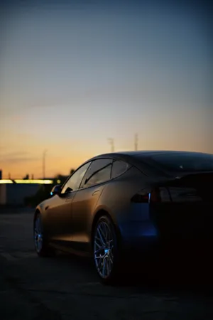 Get Charged Up For The Future With The Tesla Iphone Wallpaper