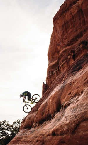 Get The Rush With A Mountain Bike On Ragged Terrain! Wallpaper