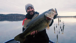 Giant Largemouth Bass On A Boat Wallpaper