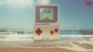 Giant Nintendo Game Boy At The Beach Wallpaper