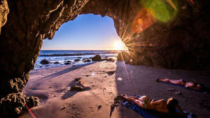 Girls Lying On Malibu Beach Wallpaper