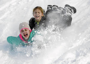 Girls Sledding Crash Wallpaper