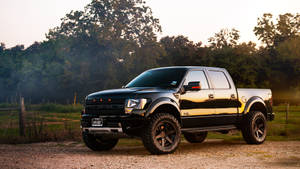 Gleaming Black Ford Raptor In Full Glory Wallpaper