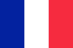 Gleaming French Flag Under Spotlight Wallpaper