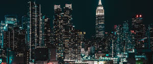 Glimpsing The Breathtaking Beauty Of Night City Wallpaper